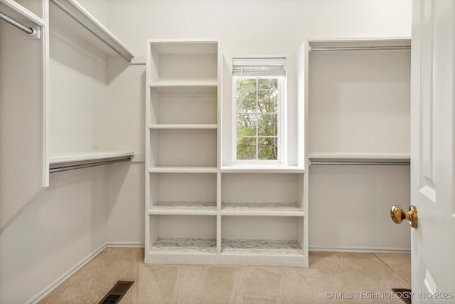 6007 E 76th Ct, Tulsa, OK 74136 - walk in closet featuring carpet flooring