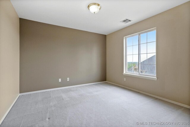 6007 E 76th Ct, Tulsa, OK 74136 - carpeted spare room with baseboards