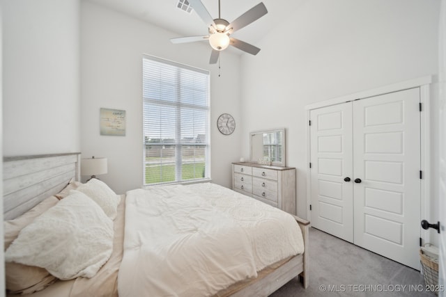 13859 S 21st Pl E, Bixby, OK 74008 - bedroom with light colored carpet, a closet, high vaulted ceiling, and a ceiling fan
