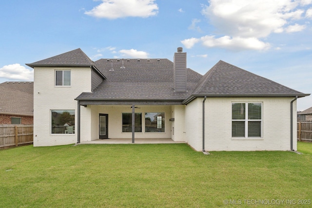 13859 S 21st Pl E, Bixby, OK 74008 - back of house featuring brick siding, roof with shingles, a chimney, and a patio area