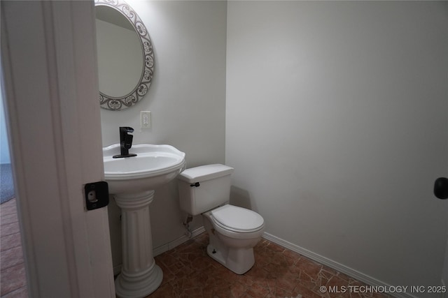 8304 E 124th E Ave, Owasso, OK 74055 - bathroom featuring toilet and baseboards