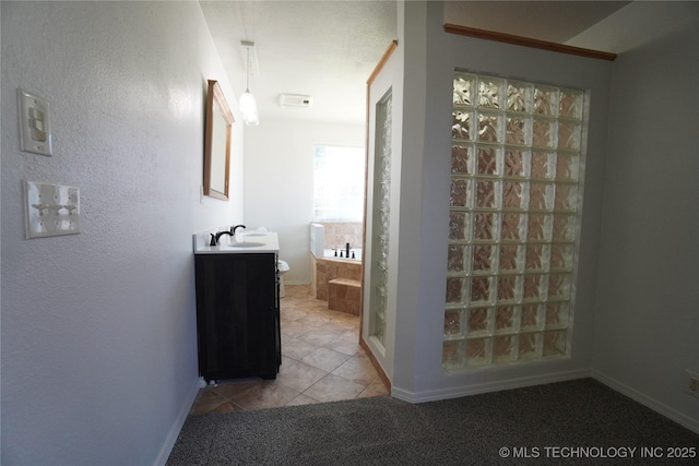 8304 E 124th E Ave, Owasso, OK 74055 - bathroom with vanity, tile patterned flooring, baseboards, and a tub