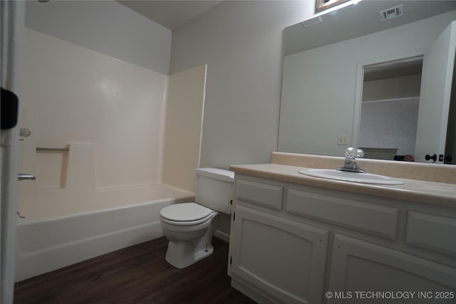 8304 E 124th E Ave, Owasso, OK 74055 - bathroom with vanity, wood finished floors, toilet, and washtub / shower combination