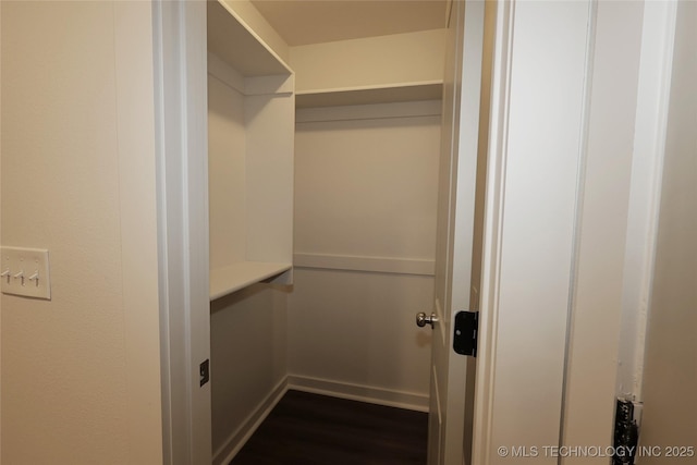 805 N Ridgeway St, Sapulpa, OK 74066 - walk in closet with dark wood-type flooring