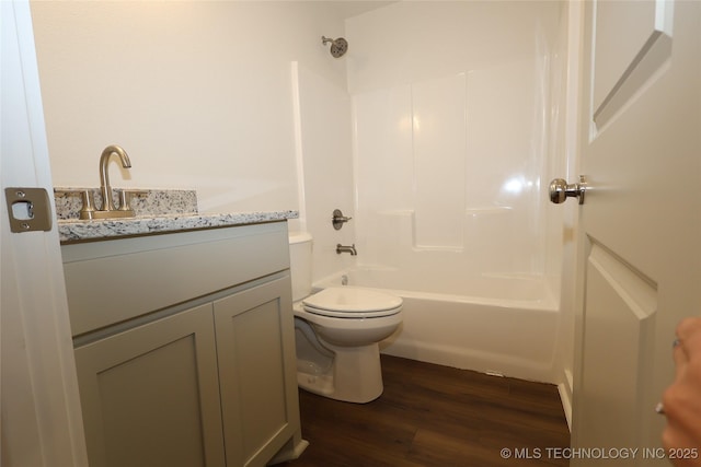 805 N Ridgeway St, Sapulpa, OK 74066 - bathroom featuring vanity, wood finished floors, toilet, and shower / bathtub combination