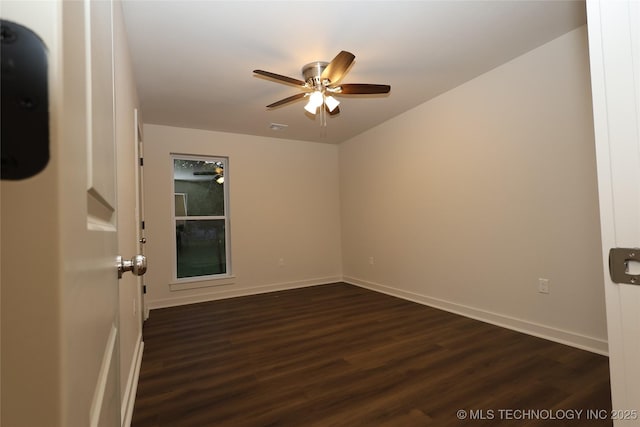 805 N Ridgeway St, Sapulpa, OK 74066 - unfurnished room featuring a ceiling fan, dark wood-style flooring, and baseboards