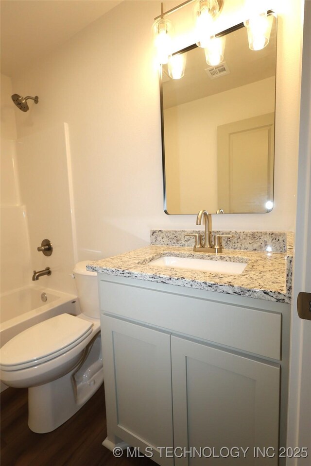 805 N Ridgeway St, Sapulpa, OK 74066 - full bath featuring vanity, wood finished floors, and shower / bathtub combination
