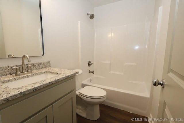 805 N Ridgeway St, Sapulpa, OK 74066 - bathroom with vanity, bathing tub / shower combination, and wood finished floors