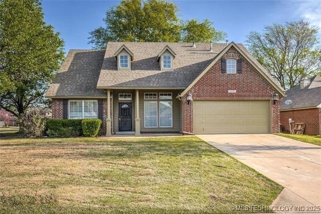 20001 E 46th St, Broken Arrow, OK 74014 - view of front of home with brick siding, driveway, a front yard, a garage, and roof with shingles