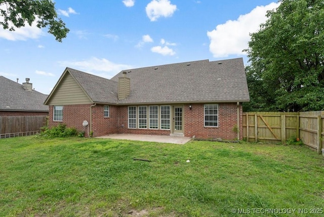 20001 E 46th St, Broken Arrow, OK 74014 - back of property with brick siding, a patio area, and a shingled roof