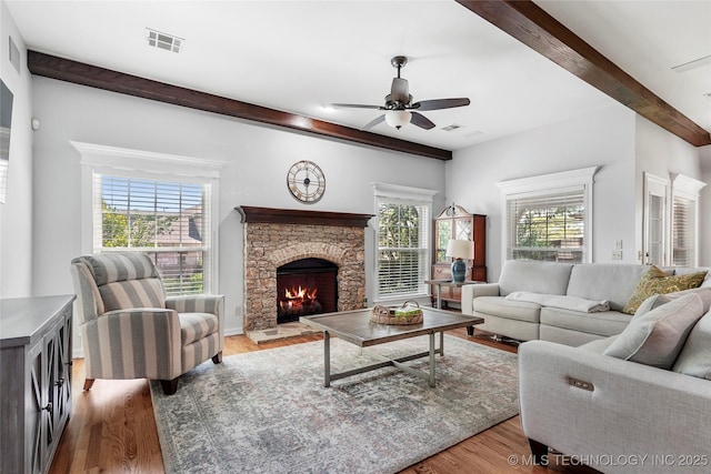 10935 S 77th Pl, Tulsa, OK 74133 - living room with beam ceiling, ceiling fan, a fireplace, and wood finished floors