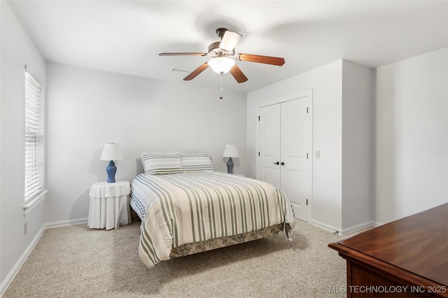 10935 S 77th Pl, Tulsa, OK 74133 - bedroom featuring baseboards, carpet flooring, a closet, and a ceiling fan