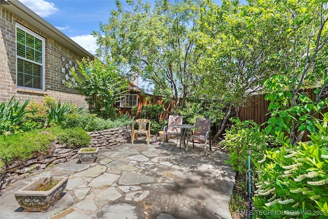 10935 S 77th Pl, Tulsa, OK 74133 - fenced backyard with a patio
