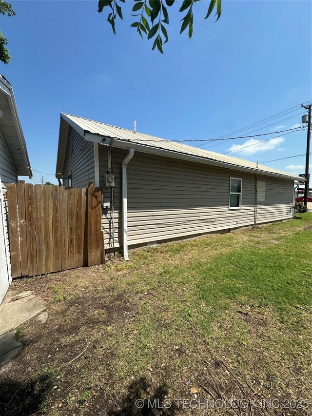 105 S B, Davis, OK 73030 - view of side of property with metal roof