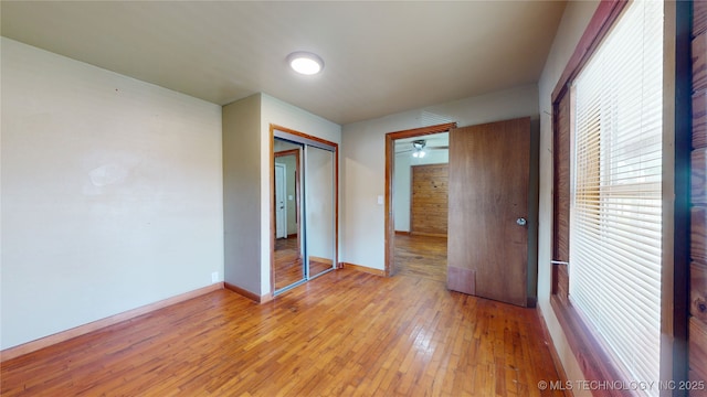 105 S B, Davis, OK 73030 - unfurnished bedroom with a closet, light wood-style flooring, and baseboards