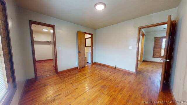 105 S B, Davis, OK 73030 - unfurnished bedroom featuring light wood-type flooring and baseboards