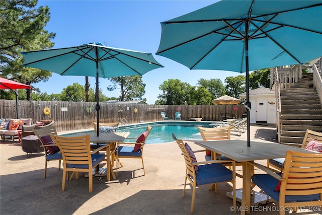 1608 Blue Stem Rd, Fort Gibson, OK 74434 - view of swimming pool featuring outdoor dining area, a fenced backyard, a patio area, and stairs