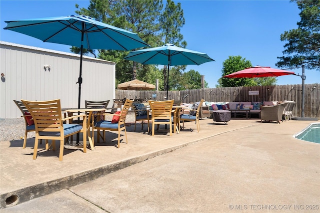 1608 Blue Stem Rd, Fort Gibson, OK 74434 - fenced backyard with outdoor dining space, a patio, and an outdoor hangout area
