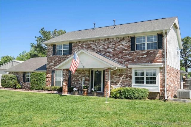1608 Blue Stem Rd, Fort Gibson, OK 74434 - traditional-style house with a front yard, brick siding, central AC, and roof with shingles