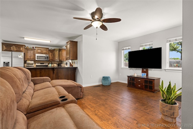 1608 Blue Stem Rd, Fort Gibson, OK 74434 - living area with ceiling fan, dark wood-style flooring, plenty of natural light, and baseboards