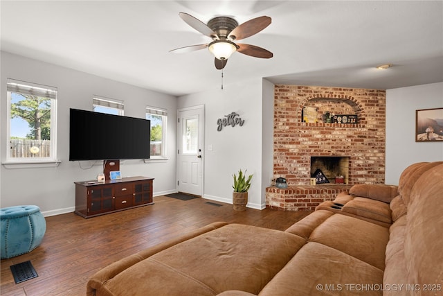 1608 Blue Stem Rd, Fort Gibson, OK 74434 - living room with hardwood / wood-style floors, a ceiling fan, baseboards, and a fireplace