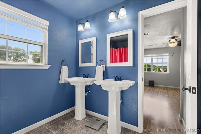 1608 Blue Stem Rd, Fort Gibson, OK 74434 - full bathroom with baseboards, ceiling fan, and a sink
