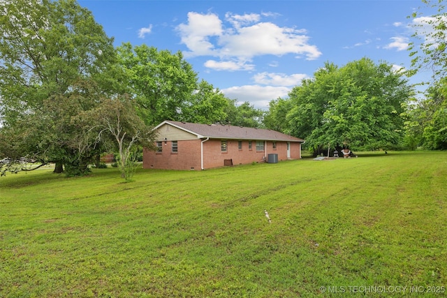 709 N Maple, Konawa, OK 74849 - view of green lawn with central AC