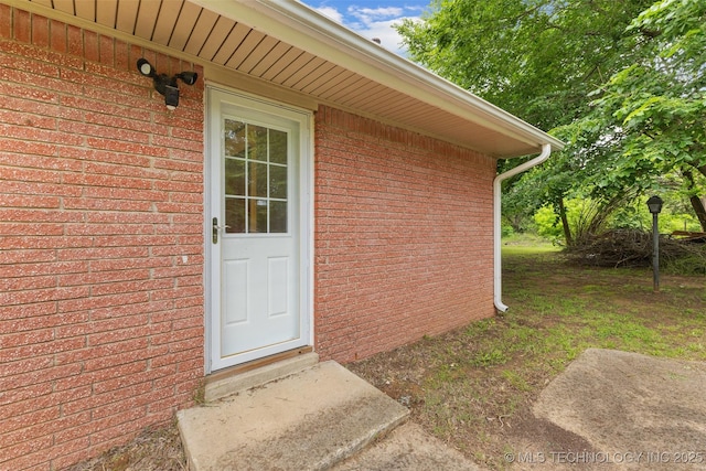 709 N Maple, Konawa, OK 74849 - doorway to property featuring brick siding