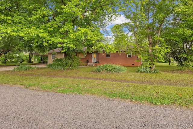 709 N Maple, Konawa, OK 74849 - view of front facade with a front lawn, a carport, and crawl space