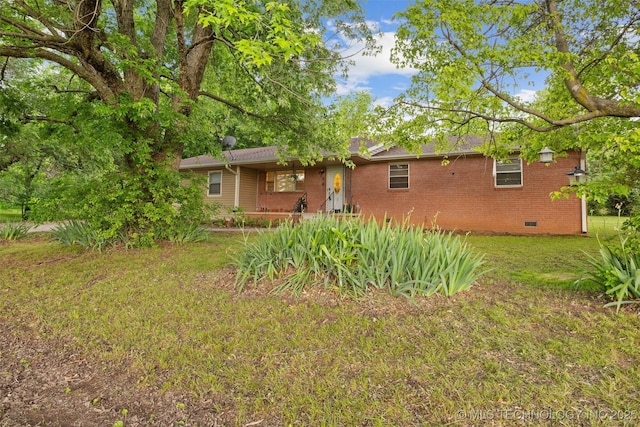 709 N Maple, Konawa, OK 74849 - rear view of property featuring crawl space, a lawn, brick siding, and a porch