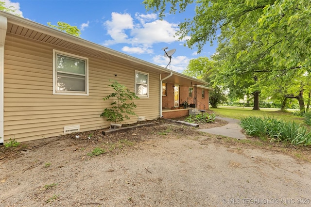 709 N Maple, Konawa, OK 74849 - view of property exterior featuring crawl space and a porch
