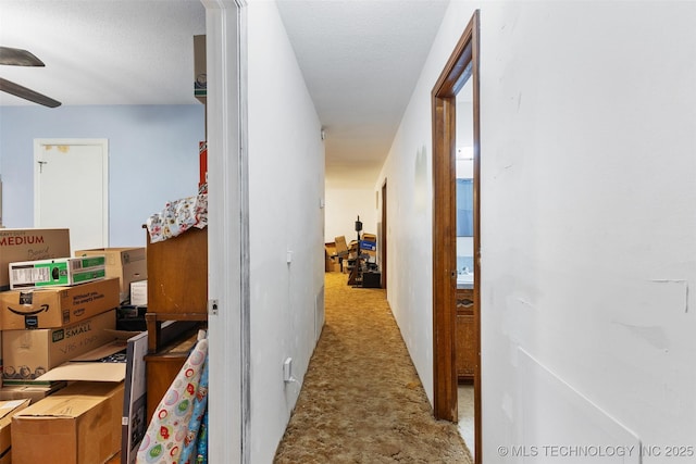 709 N Maple, Konawa, OK 74849 - hallway with tile patterned floors and a textured ceiling