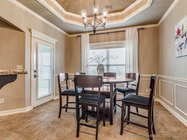 5909 E 139th St, Collinsville, OK 74021 - dining room with plenty of natural light, a chandelier, crown molding, a tray ceiling, and light tile patterned floors