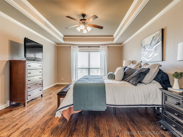 5909 E 139th St, Collinsville, OK 74021 - bedroom featuring a raised ceiling, wood finished floors, ornamental molding, baseboards, and ceiling fan