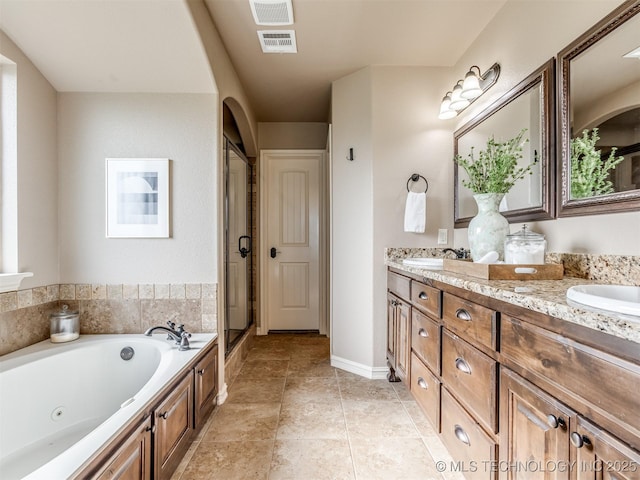 5909 E 139th St, Collinsville, OK 74021 - full bathroom featuring double vanity, a whirlpool tub, and a shower stall