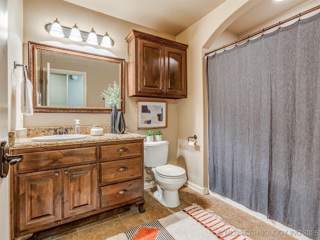 5909 E 139th St, Collinsville, OK 74021 - bathroom featuring vanity, toilet, tile patterned flooring, and a shower with curtain