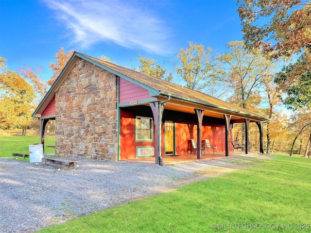20965 W 921st Rd, Cookson, OK 74427 - view of side of home featuring stone siding, a yard, and a wall mounted air conditioner