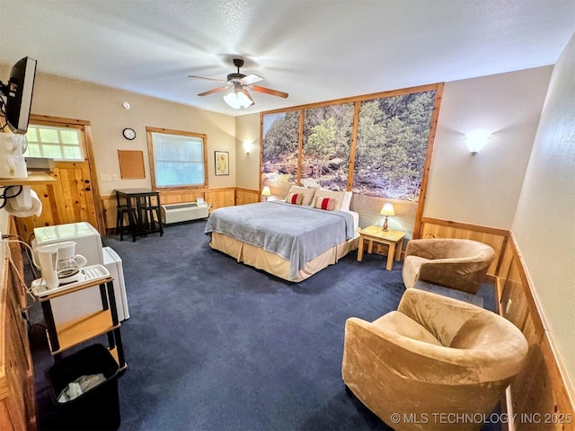 20965 W 921st Rd, Cookson, OK 74427 - bedroom with wainscoting, carpet, wooden walls, and ceiling fan
