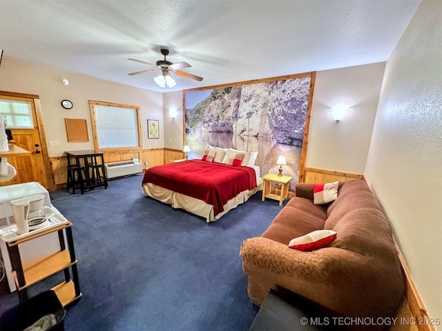 20965 W 921st Rd, Cookson, OK 74427 - carpeted bedroom with a wainscoted wall, wooden walls, multiple windows, and ceiling fan