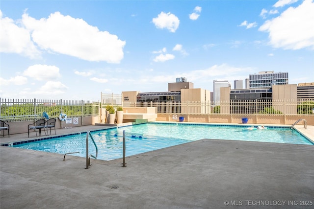 1502 S Boulder Ave Unit 16Cd, Tulsa, OK 74119 - community pool featuring a patio