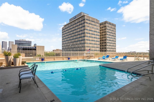 1502 S Boulder Ave Unit 16Cd, Tulsa, OK 74119 - community pool featuring a patio area