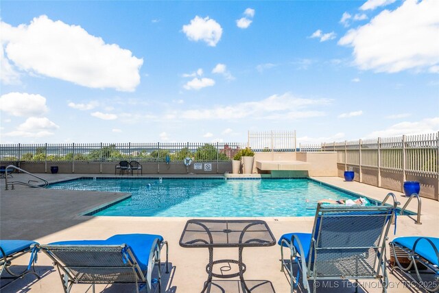 1502 S Boulder Ave Unit 16Cd, Tulsa, OK 74119 - community pool featuring a patio