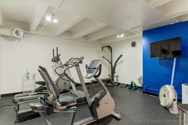 1502 S Boulder Ave Unit 16Cd, Tulsa, OK 74119 - exercise room with concrete block wall