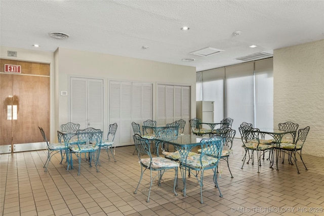 1502 S Boulder Ave Unit 16Cd, Tulsa, OK 74119 - dining space with a textured ceiling and recessed lighting