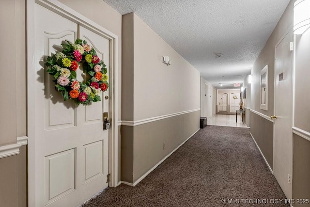 1502 S Boulder Ave Unit 16Cd, Tulsa, OK 74119 - corridor featuring carpet flooring, a textured ceiling, and baseboards
