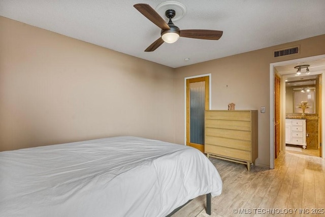 1502 S Boulder Ave Unit 16Cd, Tulsa, OK 74119 - bedroom featuring light wood-style flooring and a ceiling fan