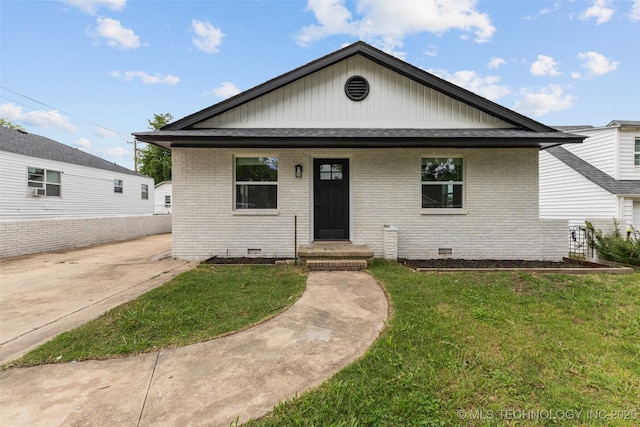 524 W 18th, Ada, OK 74820 - view of front of house with brick siding, a front lawn, crawl space, and a shingled roof