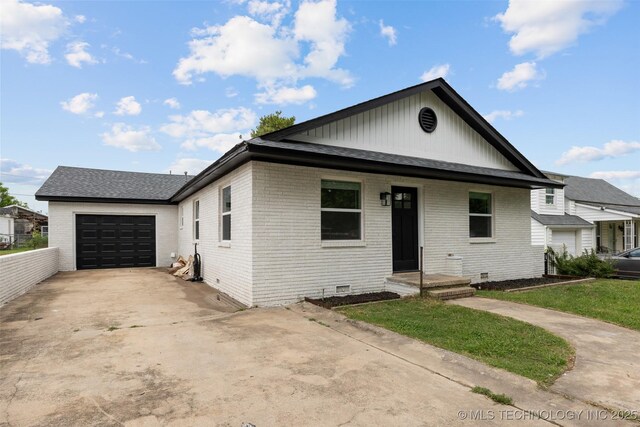 524 W 18th, Ada, OK 74820 - view of front of home with brick siding, crawl space, and an attached garage