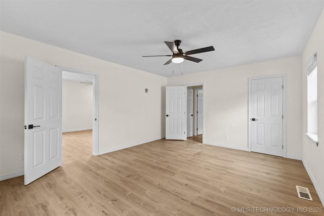 524 W 18th, Ada, OK 74820 - unfurnished bedroom with light wood-style flooring, baseboards, and a ceiling fan