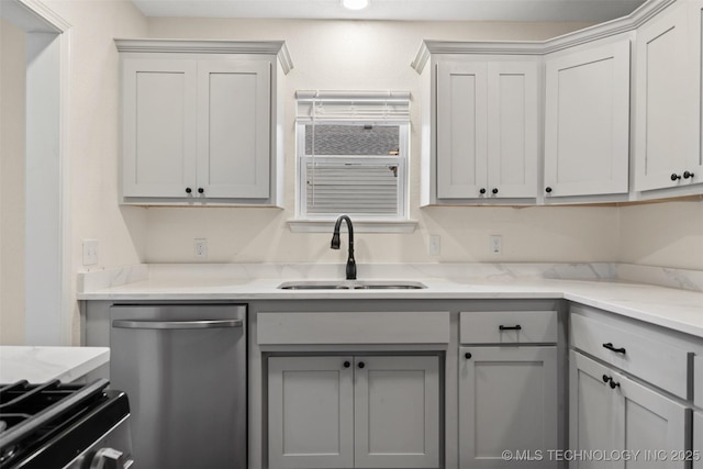 524 W 18th, Ada, OK 74820 - kitchen featuring dishwasher, a sink, gray cabinetry, and light stone countertops